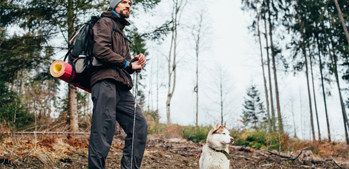 man-hiking-with-his-canine