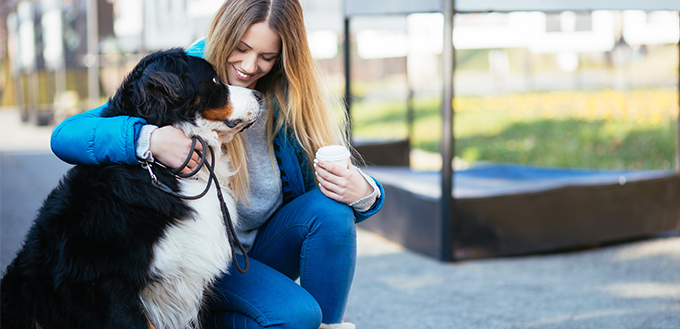 young woman enjoying with her adorable dog