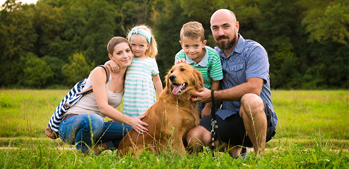 Family with their pet dog