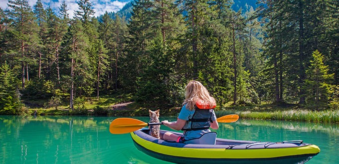Caucasian Woman in Her 30s Kayaking with Her Dog