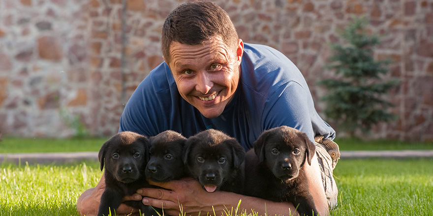 Man with puppies