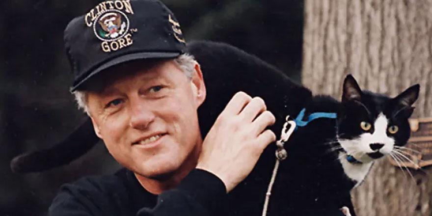 President Clinton and Socks go for a walk