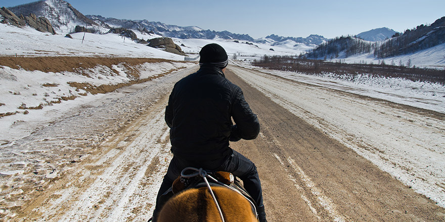 Horserider in mongolian wilderness