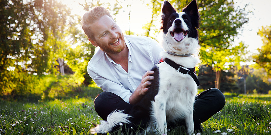 Man embracing his dog